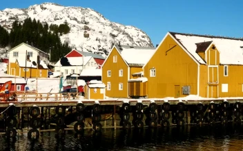 Stock Video Multi Colored Wooden Fishing Houses And Pier