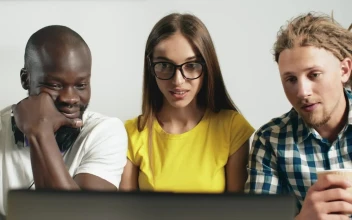 Stock Video Multiracial Friends React In Surprise While Watching Video