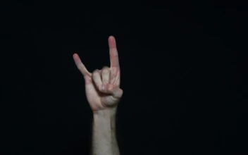 Stock Video Music Fan Making A Hand Gesture