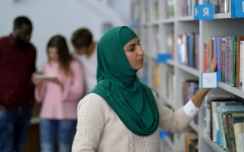 Stock Video Muslim Student Browsing A Library