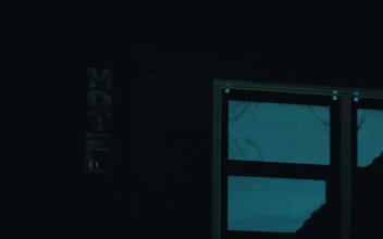 Stock Video Neon Light Of A Hotel Flickering In The Dark