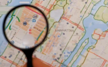 Stock Video Observing With A Magnifying Glass On A Map Of Manhattan