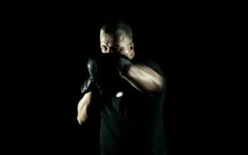 Stock Video Old Boxer Training In A Dark Room