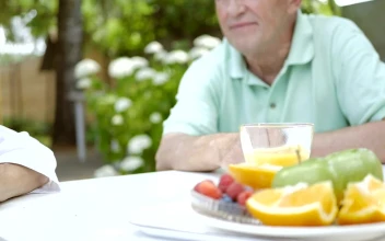 Stock Video Old Couple Holding Hands At The Table