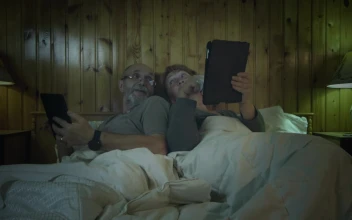 Stock Video Old Couple With Tablets In The Bedroom