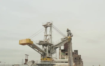 Stock Video Old Crane Loading Ships On A Coast