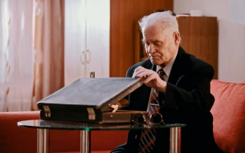 Stock Video Old Gangster Taking A Gun Out Of A Briefcase