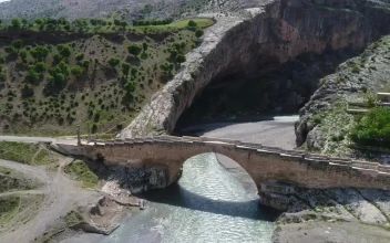 Stock Video Old Stone Bridge Across A River