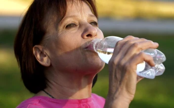 Stock Video Old Woman Drinking Water From A Bottle