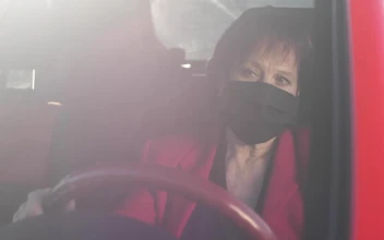 Stock Video Old Woman Wearing Mask While Driving Her Car