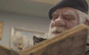 Stock Video Older Man Reading A Book