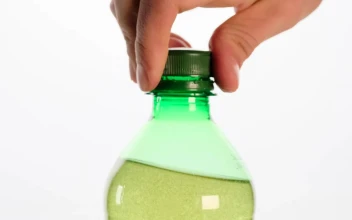 Stock Video Opening A Bottle Soda Bursting With Foam