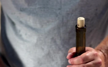 Stock Video Opening A Bottle Of Wine