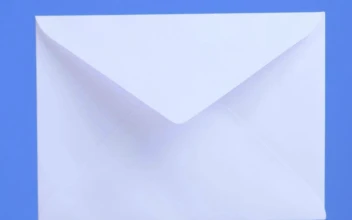 Stock Video Opening A White Envelope On A Blue Background