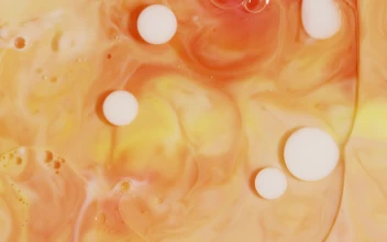 Stock Video Orange Fluid Making Abstract Forms