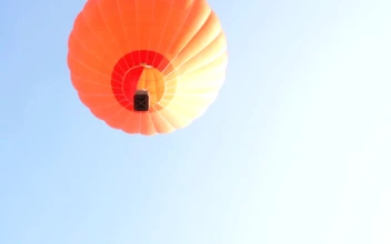 Stock Video Orange Hot Air Balloon Flying