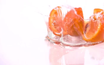 Stock Video Orange Slices Falling Into Water