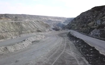 Stock Video Orange Truck Heading Through A Quarry