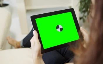 Stock Video Over Shoulder Shot Of A Person Seeing To A Tablet