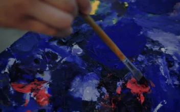 Stock Video Painter Taking Paint From A Palette