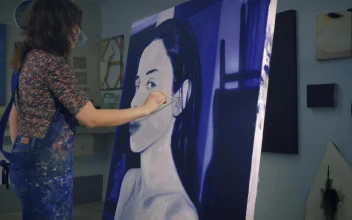 Stock Video Painter Working On A Portrait In Blue Tones