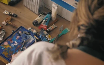 Stock Video Painter Working On An Artwork In Her Home Studio With