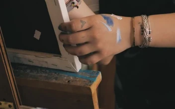 Stock Video Painting On A Canvas On A Wooden Easel