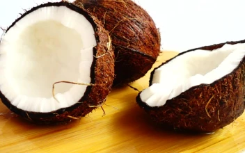 Stock Video Pair Of Coconuts Being Wet By Coconut Water