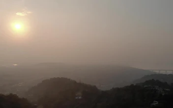 Stock Video Panorama Of A Village Between Hills Full Of Mist