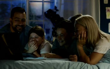 Stock Video Parents And Children Watching Movies On A Laptop
