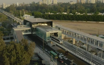 Stock Video Passenger Train Leaving A Station In An Aerial Shot