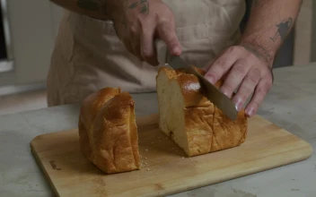Stock Video Pastry Chef Cutting A Loaf Into Slices