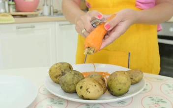 Stock Video Peeling A Carrot In The Kitchen