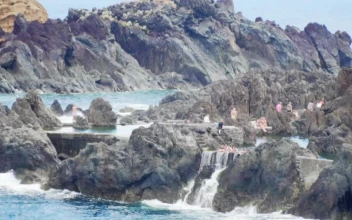 Stock Video People Bathing On The Rocks Of The Seashore