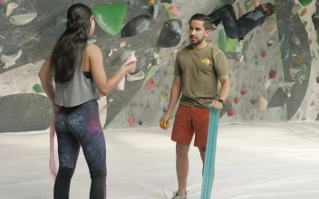 Stock Video People Chatting In A Mountaineering Gym