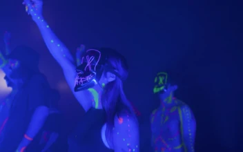 Stock Video People Dancing With Neon Masks In The Dark