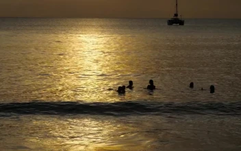 Stock Video People Enjoying The Ocean At Sunset