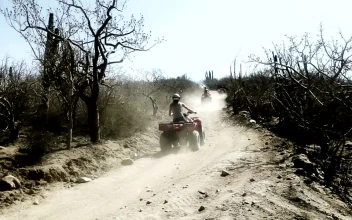 Stock Video People Using All Terrain Vehicle On A Rugged Road