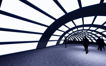 Stock Video People Walking On A Circular Tunnel With Light