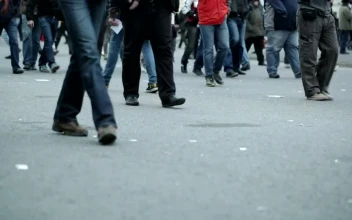 Stock Video People Walking Slowly Across Town