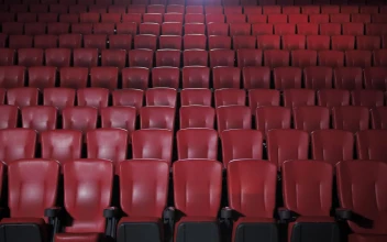 Stock Video People With Masks Sitting Apart In A Movie Theater