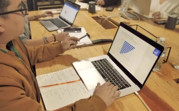 Stock Video People Working On A Wooden Table