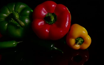 Stock Video Peppers Against A Dark Table