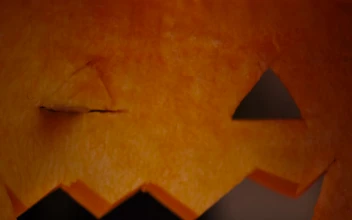 Stock Video Person Cutting A Halloween Pumpkin