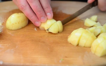 Stock Video Person Cutting Cubes Potatoes