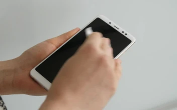 Stock Video Person Disinfecting His Cell Phone