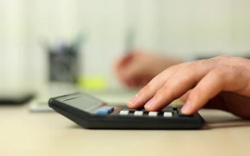 Stock Video Person Doing Calculations With A Calculator