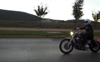 Stock Video Person Driving A Motorcycle In The Street