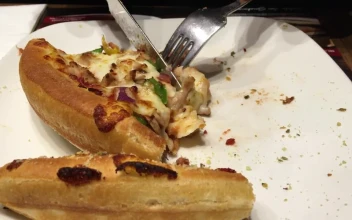 Stock Video Person Eating Pizza Using Cutlery