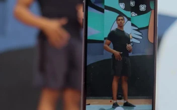 Stock Video Person Is Filmed Exercising With A Cell Phone